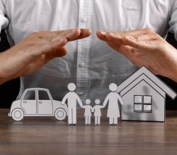 insurance house protection concepts, Hands post protect over house.